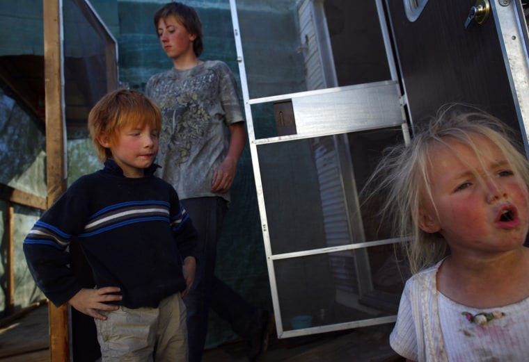 ATTENTION EDITORS: PICTURE 2 OF 30 FOR PACKAGE 'LIFE IN SLAB CITY' (L-R) Timothy, Zack and Casey Spyder are seen in Slab City just outside Niland, California February 17, 2012. A former military base that was closed after World War II, Slab City is a place on the fringe both geographically and philosophically and attracts a variety of people, including jobless and financially struggling recession refugees who can no longer pay for food and housing Picture taken February 17, 2012. REUTERS/Eric Thayer (UNITED STATES - Tags: SOCIETY)