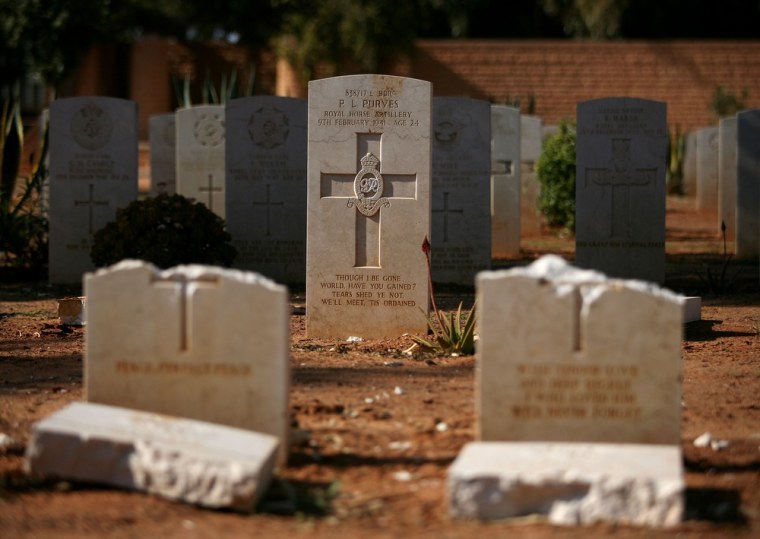 Graves of British soldiers of the Royal Horse Artillery (RHA), are seen at the Commonwealth Benghazi War Cemetery holding the remains of British and Commonwealth soldiers who fought during the second world war in the north African desert battles, after it was desecrated by a mob of angry Libyans days earlier. Local reports claimed the group were Islamists angered by the recent burning of a Koran at a NATO military base in Afghanistan. Libya's national transitional government has apologised for the attacks and local authorities have detained several suspects. (AP Photo/Manu Brabo)