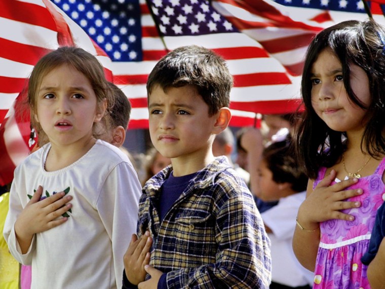 **FILE** Though some were a bit unsure of the words or exactly where to place your hand over your heart, some of the 700 students at Nevada Avenue Elementary School recite the Pledge of Allegiance, as part of nationwide post-Sept. 11 ceremonies to honor America in this Oct. 12, 2001, file photo in the Canoga Park district of Los Angeles' San Fernando Valley. A federal appeals court Wednesday, June 26, 2002, declared the Pledge of Allegiance unconstitutional because of the words \"under God\" added by Congress in 1954.  In a 2-1 decision, the 9th U.S. Circuit Court of Appeals said the phrase amounts to a government endorsement of religion in violation of the Constitution's Establishment Clause, which requires a separation of church and state. (AP Photo/Reed Saxon)