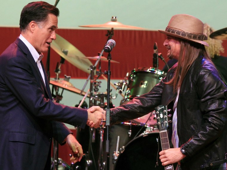 Republican presidential candidate, former Massachusetts Gov. Mitt Romney, shakes hands with Kid Rock at a campaign event at the Royal Oak Music Theatre in Royal Oak, Mich., Monday, Feb. 27, 2012. (AP Photo/Carlos Osorio)