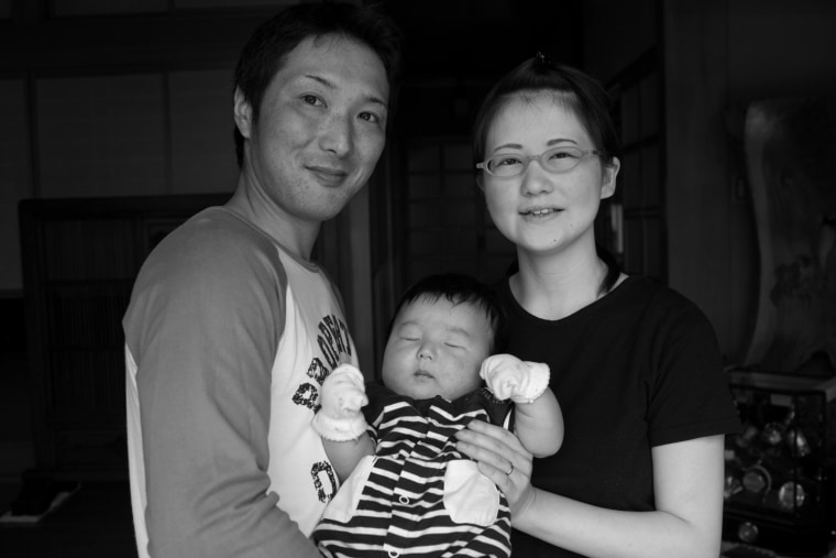 Koya Takahashi, 28, and his wife Megumi Takahashi, 27 hold thier three month old baby, Nagato, outside Megumi's parents home in Minamisanriku, Japan, Monday, June 13, 2011. (Jim Seida / msnbc.com)