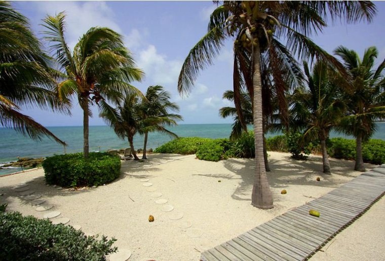Sandy beaches and a private boardwalk to the dock add to the island's appeal.