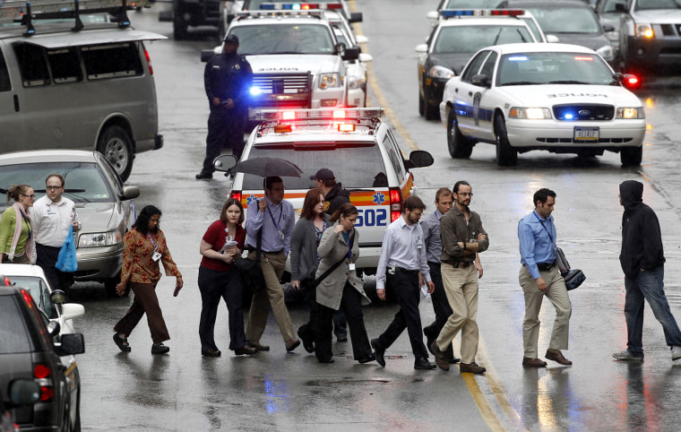 Police evacuate people from the Western Psychiatric Institute and Clinic of University of Pittsburgh Medical Center in Pittsburgh, Pennsylvania after several people were shot in the building on March 8, 2012. Two people were killed in a shooting at the University of Pittsburgh Medical Center on Thursday, and one of the dead was believed to be the shooter, the hospital said. REUTERS/ Jason Cohn (UNITED STATES - Tags: CIVIL UNREST POLITICS)