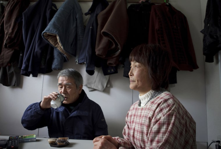 Katsushi Haga, 67, left, sips a cup of tea as he sits with his wife, Eiko, 61, at their temporary house in Koizumi district of Kesennuma in Miyagi prefecture, Japan on Feb 27, 2012. The tsunami on March 11, 2011 flattened the district, destroying 266 of its 518 households and killed about 30 of its estimated 1,800 residents, including Haga’s 87-year-old mother, Tomiko. Photo by Kuni Takahashi