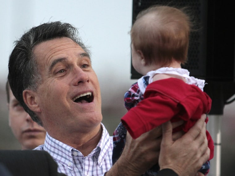 U.S. Republican presidential candidate and former Massachusetts Governor Mitt Romney holds the baby of a supporter during a campaign rally at the Port of Pascagoula in Pascagoula, Mississippi, March 8, 2012. REUTERS/Dan Anderson (UNITED STATES)