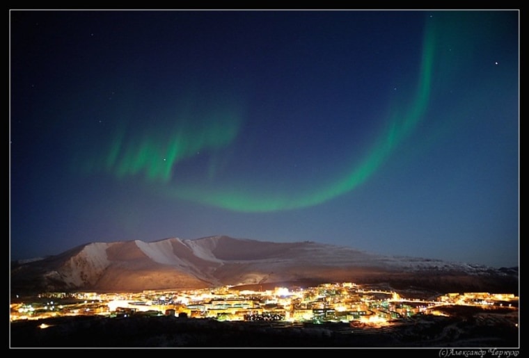 An auroral display stretches over Russia's Kola Peninsula, around Mount Khibiny, in a picture taken by Aleksander Chernucho.
