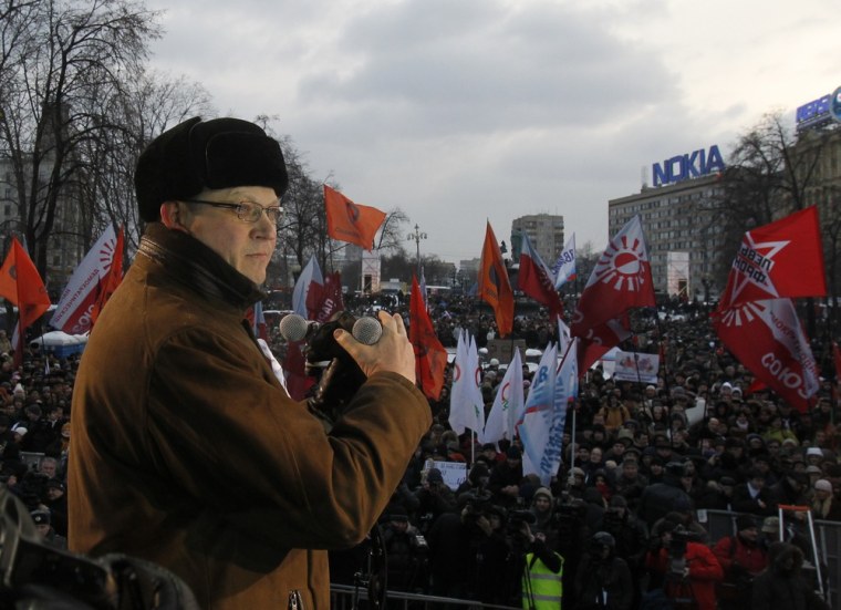 Opposition leader Vladimir Ryzhkov speaks during a protest demanding fair elections in central Moscow March 5, 2012. International monitors said Russia's presidential election was clearly skewed to favour Vladimir Putin, a verdict that could spur protesters planning to take to the streets to challenge his right to rule. REUTERS/Denis Sinyakov (RUSSIA - Tags: POLITICS ELECTIONS CIVIL UNREST)
