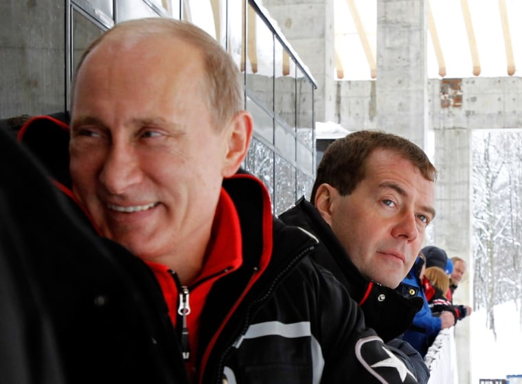 Russia's outgoing President Dmitry Medvedev (R) and President-elect Vladimir Putin (L) attend a training session as they visit the luging sport center at the alpine ski resort in Krasnaya Polyana, some 50kms from Sochi on March 9, 2012. Italy's ex-prime minister Silvio Berlusconi flew into Russia for a lavish dinner with Vladimir Putin after his old ally's victory in presidential elections, state television said . AFP PHOTO/ RIA-NOVOSTI/ KREMLIN POOL/ DMITRY ASTAKHOV (Photo credit should read DMITRY ASTAKHOV/AFP/Getty Images)