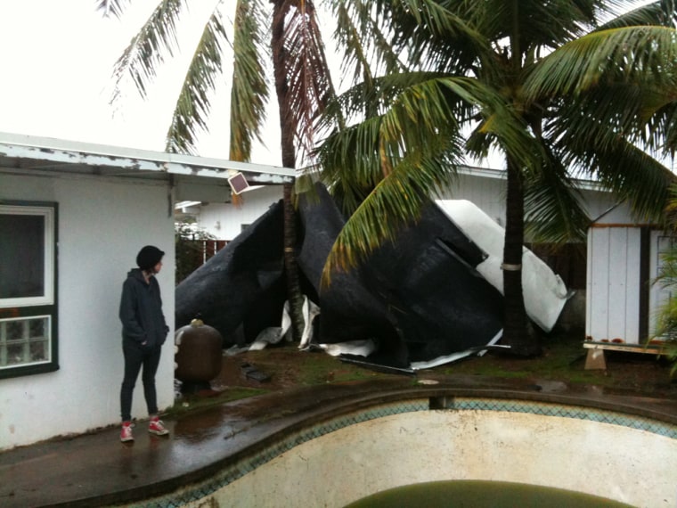 A section of a roof was blown off by an unconfirmed waterspout in Enchanted Lake.