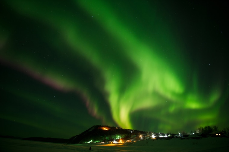 In this Friday, March 9, 2012 photo, an aurora borealis swirls in the sky over the Yukon River village of Ruby, Alaska, a checkpoint of the Iditarod Trail Sled Dog Race. (AP Photo/The Anchorage Daily News, Marc Lester)