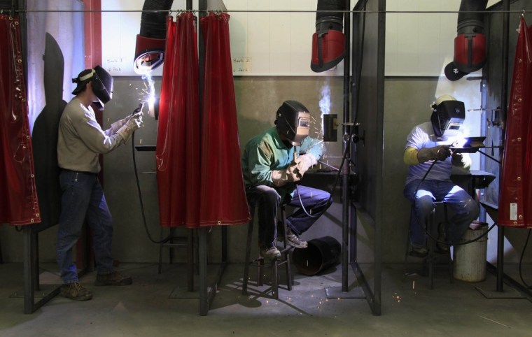 First year Ironworker apprentices (L-R) Ian Welshhans, Daniel Truax and Jason Taylor practice their welding skills during a class at the Ironworkers Local 549 training facility in Wheeling, West Virginia March 6, 2012. The iron workers' labor union is hoping to see a large number of jobs come from the proposed Shell cracker plant that they hope will be built in the region. Picture taken March 6, 2012. To match Feature APPALACHIA-CHEMICALPLANT/ REUTERS/Jason Cohn (UNITED STATES - Tags: BUSINESS EMPLOYMENT INDUSTRIAL)