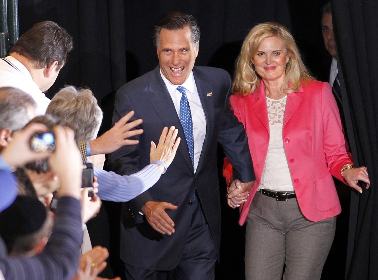 Republican presidential candidate, former Massachusetts Gov. Mitt Romney, and his wife Ann greet supporters as they arrive at their Super Tuesday primary night rally in Boston, Tuesday, March 6, 2012. (AP Photo/Gerald Herbert)