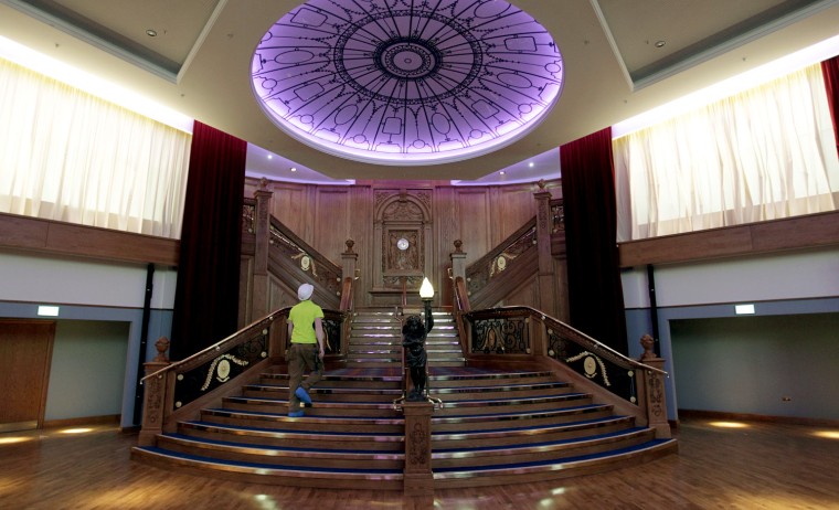 In this photo of Tuesday March 13, 2012 a replica of the the famous staircase onboard the Titanic Ship is on display in the new 100 million British pounds ($157 million)Titanic Belfast Visitor's Center, in Belfast, Northern Ireland. Celebrating the ship and the people who built her is the aim of Titanic Belfast, a shiny new
