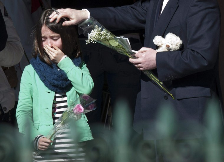epa03145574 Relatives of victims leave the hotel des Vignes, where the families of victims are staying, the day after a tourist bus from Belgium crashed in a tunnel of the motorway A9, in Uvrier, western Switzerland, 15 March 2012. Twenty-eight people, including 22 children, returning to Belgium from a skiing holiday died in a bus accident in Sierre in the Swiss canton of Valais, Swiss police said 14 March 2012. EPA/LAURENT GILLIERON