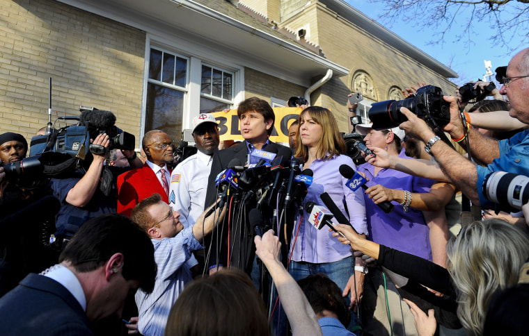 epa03145082 Former Illinois Governor Rod Blagojevich (C) speaks outside his home as his wife Patti (R) stands by his side on the day before he is to report to prison on his corruption conviction in Chicago, Illinois, USA 14 March 2012. Blagojevich was convicted for attempting to sell the US Senate seat formerly held by President Barack Obama, among other charges. EPA/TANNEN MAURY