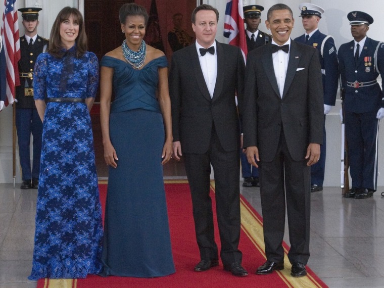 U.S. President Barack Obama (R) and First Lady Michelle Obama (2nd L) receive Britain's Prime Minister David Cameron (2nd R) and his wife Samantha (L) as they arrive for an official dinner in their honor at the White House in Washington March 14, 2012. REUTERS/Jonathan Ernst (UNITED STATES - Tags: POLITICS TPX IMAGES OF THE DAY)