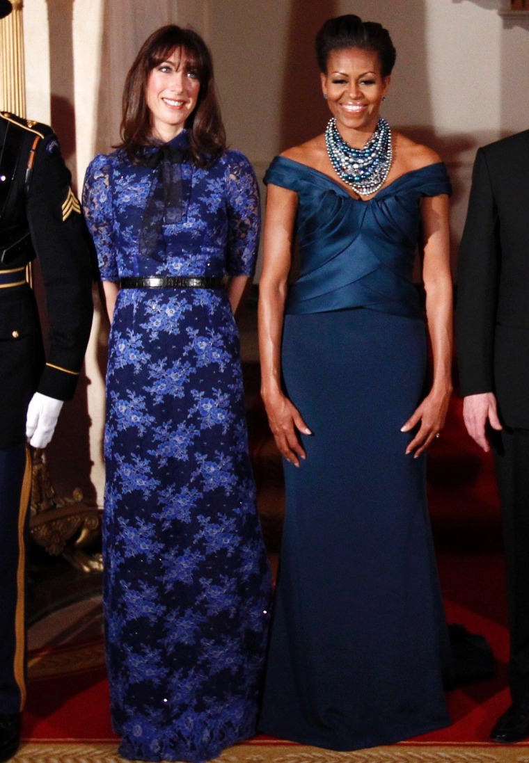 Got the blues: U.S. first lady Michelle Obama and Samantha Cameron, wife of British Prime Minister David Cameron, pose together before the State Dinner at the White House in Washington on March 14.