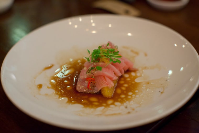 The hama chili, which features yellowtail sashimi, sliced Thai chili and orange slices.