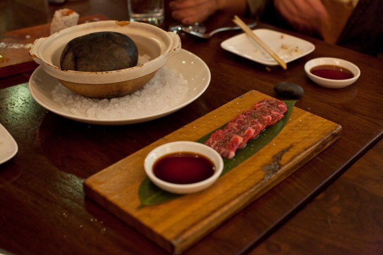 Wagyu beef slices that you sear yourself on a hot rock.