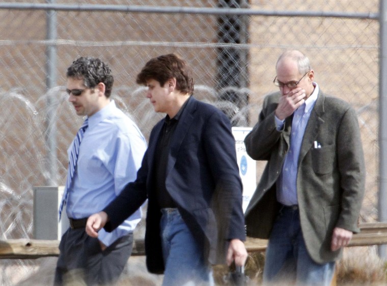 Former Illinois Gov. Rod Blagojevich, center, walks with attorneys as he arrives at the Federal Correctional Institution Englewood in Littleton, Colo., on Thursday, March 15, 2012, where he began serving his 14-year sentence for corruption. (AP Photo/Ed Andrieski)