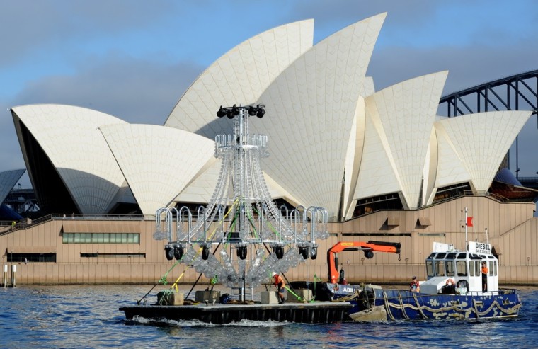 SYDNEY, AUSTRALIA - MARCH 16: A 9m x 9m chandelier is piloted by barge across Sydney Harbor March 16, 2012 in Sydney, Australia. The chandalier was bound for a special-built 25 meter stage at the Royal Botanic Gardens for the March 24 opening night of Handa Opera on Sydney Harbour - La Traviata. The production runs for three weeks. (Photo by James Morgan/Opera Australia via Getty Images)