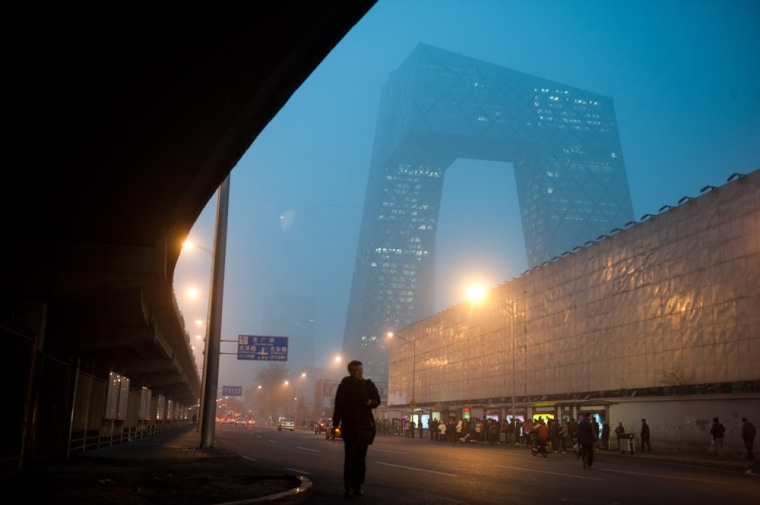 The new China Central Television (CCTV) tower hardly visible as fog covers most of Beijing on March 17, 2012. More than 400 flights to and from Beijing airport, including around 35 international services, were cancelled or delayed due to thick fog and strong air pollution covering the city, which the US embassy own measuring system, said pollution in Beijing had reached the