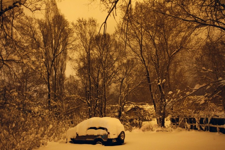 Several inches of snow cover a parked vehicle in Flagstaff, Arizona March,18 2012. The late winter storm kept temperatures well below normal in California on Sunday and generated heavy snow fall in several states, including Arizona, where several highways in the northern part of the state were temporarily closed, according to the Arizona Department of Transportation. REUTERS/Joshua Lott (UNITED STATES - Tags: ENVIRONMENT)