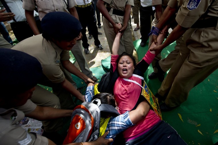 A Tibetan activist is detained by Indian police during a protest in New Delhi on March 28, 2012. A Tibetan exile who set himself alight two days ago in New Delhi in a protest against a visit to the city by Chinese President Hu Jintao died, doctors said. AFP PHOTO/ Manan VATSYAYANA (Photo credit should read MANAN VATSYAYANA/AFP/Getty Images)