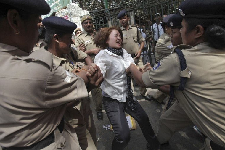A Tibetan exile is detained by police during a protest against the visit of Chinese President Hu Jintao to India, in New Delhi March 28, 2012. Hu is scheduled to attend the BRICS (Brazil, Russia, India, China and South Africa) Summit in India on March 29. REUTERS/Adnan Abidi (INDIA - Tags: POLITICS CIVIL UNREST)