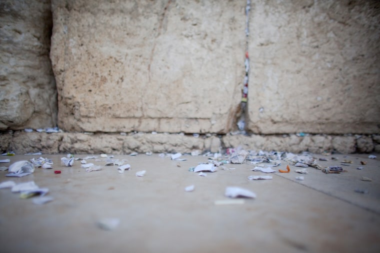 JERUSALEM, ISRAEL - MARCH 28: (ISRAEL OUT) Messages and prayers written by thousands of people addressed to God from the cracks in the Western Wall are seen on the floor atfer they were removed in preparation for the up coming Jewish Passover holiday on March 28, 2012 in Jerusalem's old city, Israel. All the notes once collected will be buried in a special place at the Mount of Olives.according tro Jewish law. Passover begins in the evening of Friday, April 6 and commemorates the story of the Exodus where the ancient Israelites were freed from slavery in Egypt. (Photo by Uriel Sinai/Getty Images)