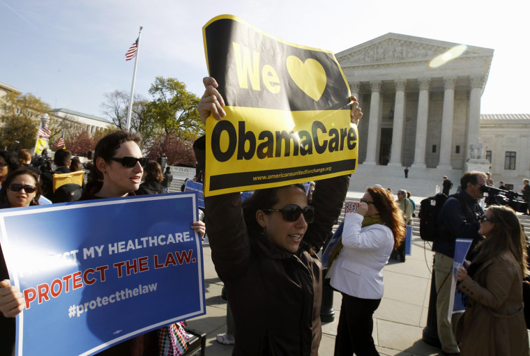 Supporters of health care reform rally in front of the Supreme Court in Washington, Wednesday, on March 28, on the final day of arguments regarding the health care law signed by President Barack Obama.