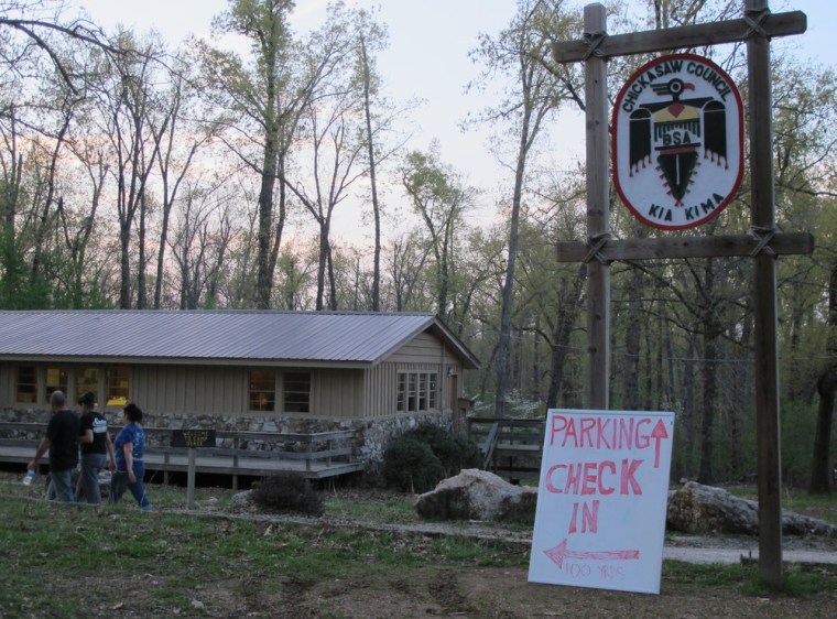 Searchers walk toward the river at Kia Kima Boy Scout camp near Hardy, Ark., before 4-year-old Caleb Linn's body was found.