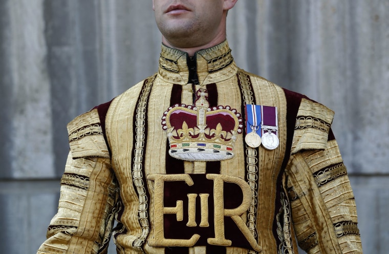 A State Trumpeter of the Household Cavalry Mounted Regiment arrives at the Hyde Park Barracks in London March 28, 2012.
