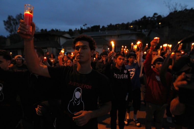 Mourners hold a candlelight vigil to remember Shaima Alawadi outside her home in El Cajon, California March 28, 2012.