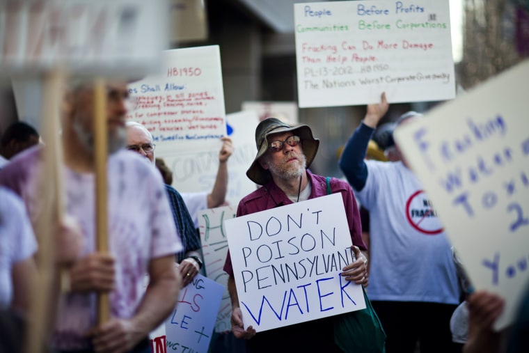 Anti-fracking protestors concerned about natural gas development in the Marcellus Shale gather outside the Marcellus Midstream Conference and Exhibition, which promotes the development of infrastructure needed to transport and process natural gas, at the David Lawrence Convention Center in downtown Pittsburgh, Pa., March 20.