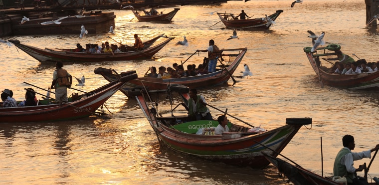 Commuters cross the Yangon river in Yangon on March 29. More than two decades after its stolen election win, Aung San Suu Kyi's opposition party is set for a dramatic political comeback in Myanmar polls which could herald an easing of sanctions.