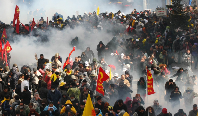 Police use tear gas to disperse demonstrators during a protest against a government attempt to railroad a new education bill through parliament in Ankara, Turkey, on March 29. Police used tear gas and water cannons to break up the demonstration, which had been called by the KESK public service union with the aim of marching on parliament.
