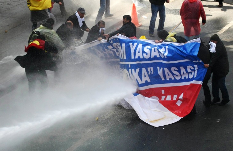 Police use water cannon to disperse demonstrators during a protest against a government attempt to railroad a new education bill through parliament in Ankara, Turkey, on March 29.