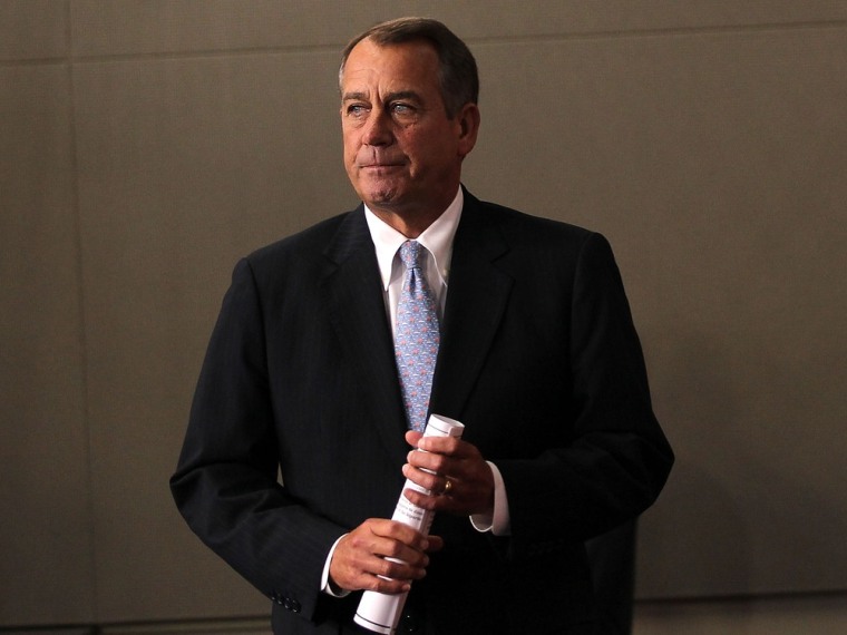 House Speaker John Boehner arrives for a news briefing on the GOP's budget proposal March 29 on Capitol Hill.