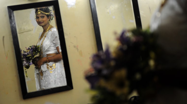 Former Tamil Tiger rebels prepare backstage during a rehabilitation official ceremony fashion show in Colombo on March 29. The program to release nearly 400 former combatants to their families. Officials said more than 10,000 ex-combatants have been rehabilitated and released to their families since the war ended in May 2009.