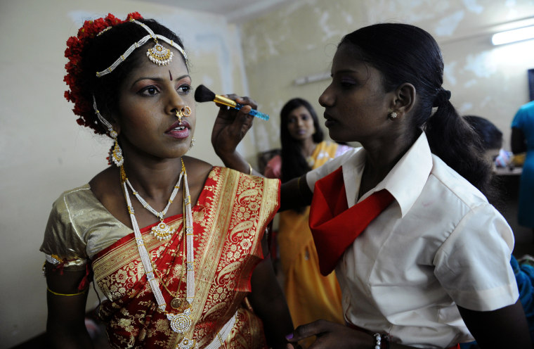 Refugees from Tamil Tiger areas cross over from Tamil Tiger rebel