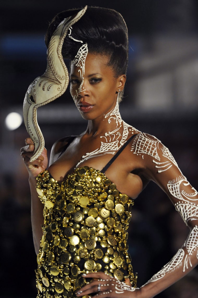 A model presents a creation made of chocolate at a fashion show on the occasion of the 'Salon du Chocolat' in Zurich, Switzerland on Thursday, March 29, 2012