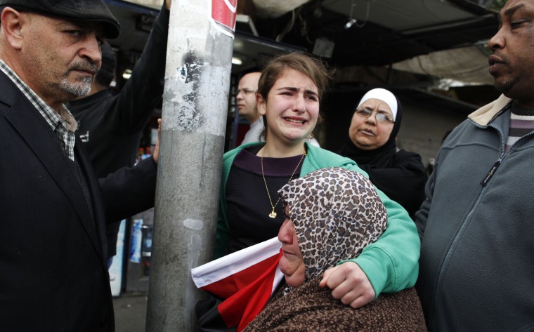 A Palestinian girl holds her mother and cries during a demonstration marking Land Day in the east of the city on March 30, outside the old city of Jerusalem, Israel. Land Day, which began in 1976, marks the day Israeli forces killed six Palestinians during a protest against Israeli occupation of what Palestinians consider to be their land. Palestinians around the world will commemorate Land Day with protests and demonstrations.