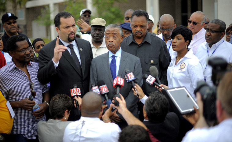 Civil rights activist the Reverend Al Sharpton center, civil rights activist the Reverend Jesse Jackson, right, and National Association for the Advancement of Colored People President Ben Jealous, left, brief the media before joining residents and rally attendees in a march through the streets of the Goldsboro neighborhood of Sanford, Fla., March 31. Reports state that the gathering is a protest against the Sanford Police Department's failure to arrest the man accused of killing 17 year-old Trayvon Martin in February 2012. Police say Martin was unarmed when he was shot by neighborhood watch volunteer George Zimmerman.
