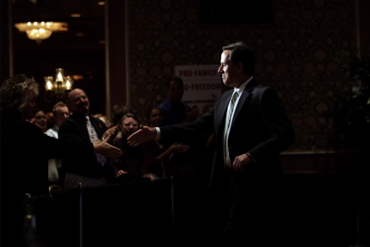 Republican presidential candidate, former Pennsylvania Sen. Rick Santorum, shakes hands with supporters after speaking at the Faith and Freedom Coalition Presidential Kick-Off in Pewaukee, Wis., Saturday, March 31, 2012. (AP Photo/Jae C. Hong)