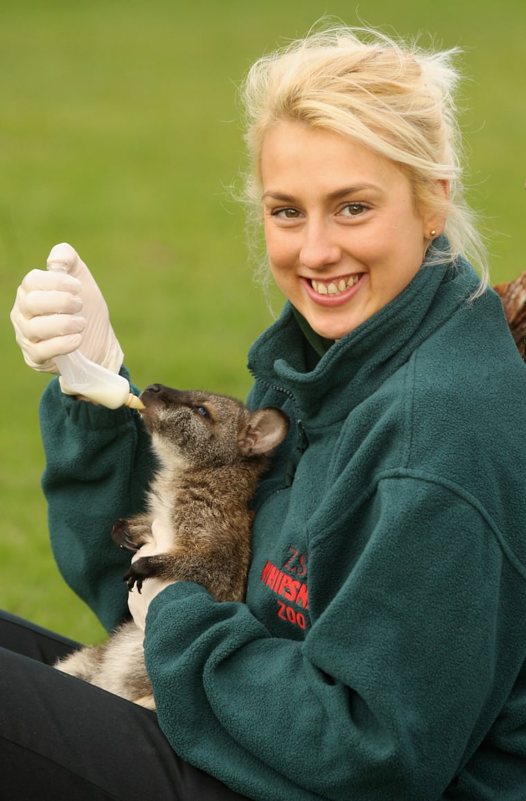Zookeeper Jo Shirley feeds Tilly with milk at ZSL Whipsnade Zoo on April 30.