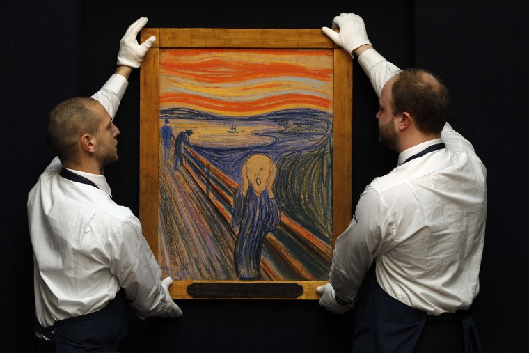 Sotheby's employees with Edvard Munch's painting \"The Scream,\" which will be auctioned Wednesday.
