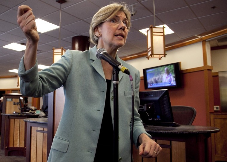 Elizabeth Warren responds to questions from reporters about her Native American heritage during a news conference at Liberty Bay Credit Union headquarters, in Braintree, Mass. on May 2.