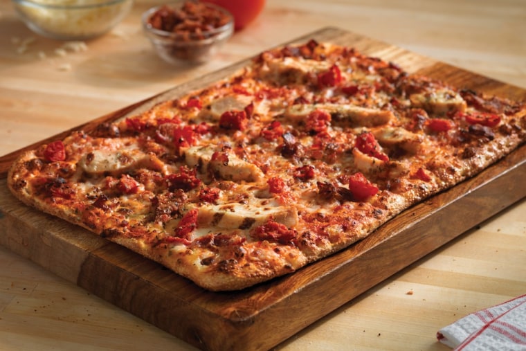 This photo provided by Dominos shows a Domino's Pizza. The pizza chain said Monday that it will begin offering gluten-free pizza crusts for customers who are sensitive to wheat, rye or barley.