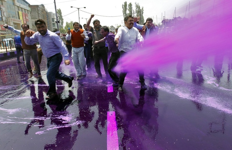 Indian police in Srinagar on May 9 used a water cannon and batons to disperse hundreds of government employees while detaining dozens as they attempted to reach the civil secretariat.